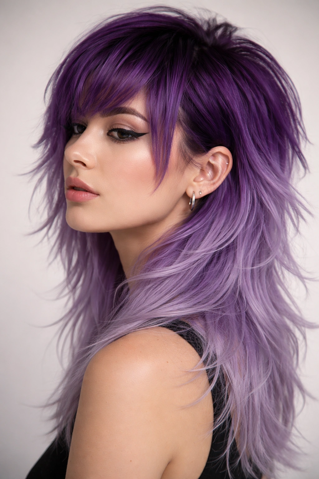 Layered purple ombre mullet fading from deep purple to lavender