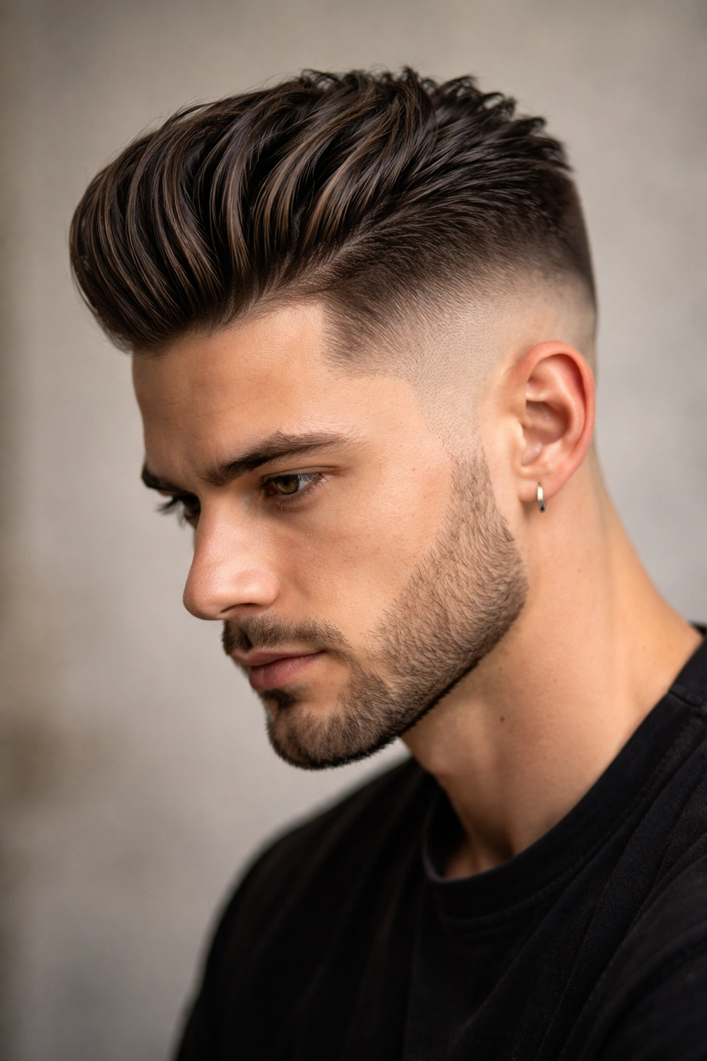 Slicked-back fade with textured crown for cowlick management