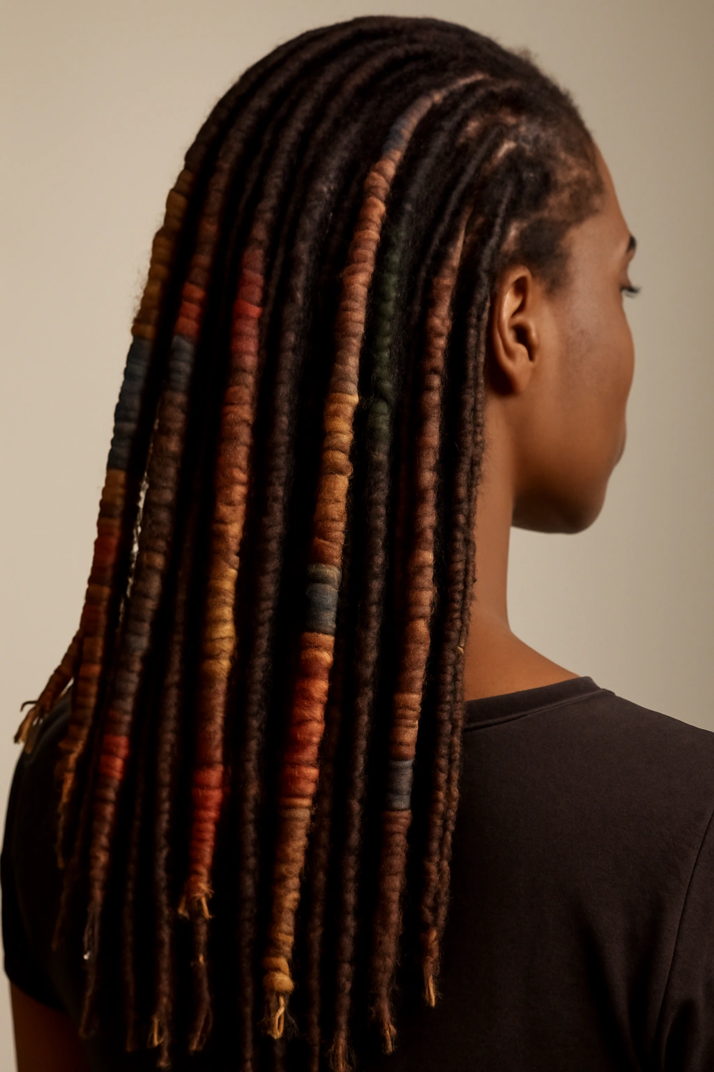 Wrapped locs with visible fiber wraps along their length